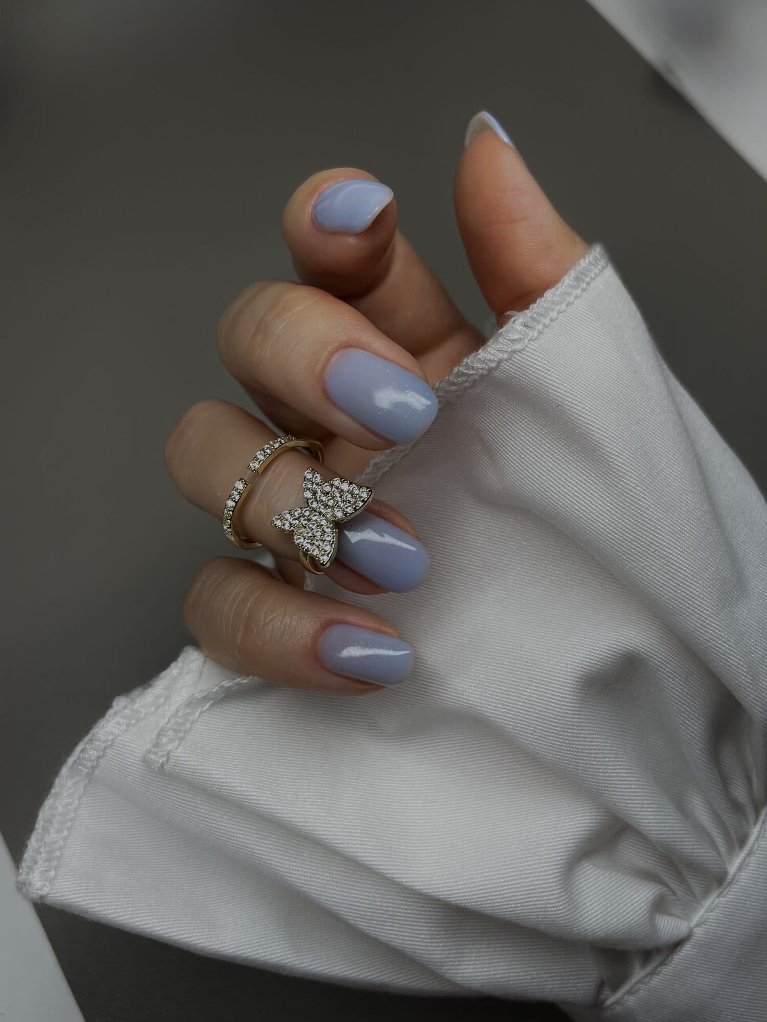 Pale blue and lilac nails with a soft gradient